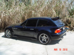 2002 BMW M Coupe in Black Sapphire Metallic over Estoril Blue & Black Nappa - Back SideRear 3/4
