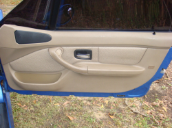 1999 BMW M Coupe in Estoril Blue Metallic over Dark Beige Oregon - Passenger Door