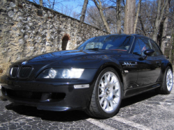 1999 BMW M Coupe in Cosmos Black Metallic over Imola Red & Black Nappa - Front 3/4