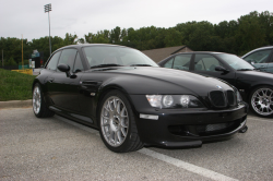 1999 BMW M Coupe in Cosmos Black Metallic over Imola Red & Black Nappa - Front 3/4