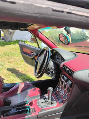 1998 BMW M Roadster in Arctic Silver Metallic over Imola Red & Black Nappa