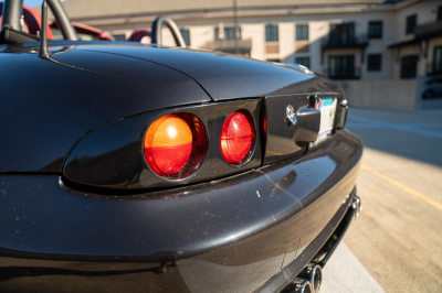 1998 BMW M Roadster in Cosmos Black Metallic over Imola Red & Black Nappa