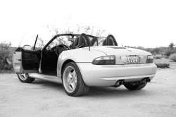 1999 BMW M Roadster in Arctic Silver Metallic over Imola Red & Black Nappa