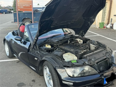 1999 BMW M Roadster in Cosmos Black Metallic over Imola Red & Black Nappa