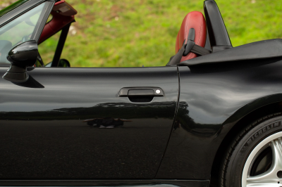 2002 BMW M Roadster in Black Sapphire Metallic over Imola Red & Black Nappa