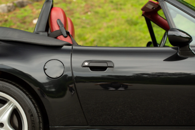 2002 BMW M Roadster in Black Sapphire Metallic over Imola Red & Black Nappa